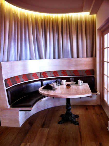 Curved banquette makes functional out