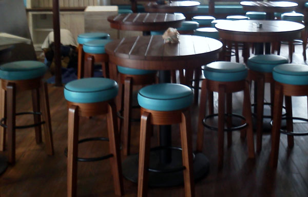 Custom built bar stools and mahogany tables